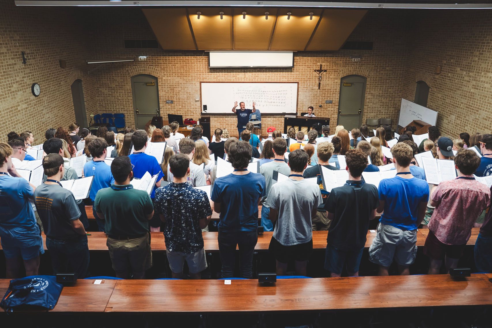 ACCS National Honor Choir students practicing music with Dr. David Erb, director of the Conservatory of Music at New Saint Andrews College in Moscow, Idaho.